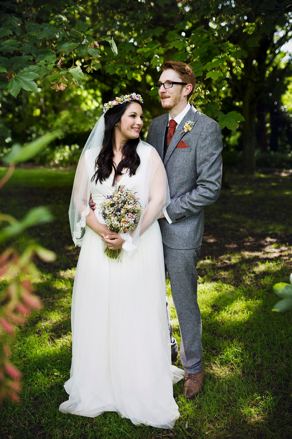 Etsy illustrator Kerris wore an ASOS wedding dress for her boho and handmade village hall wedding. We love the comic book confetti! Photography by Mark Tattersall.