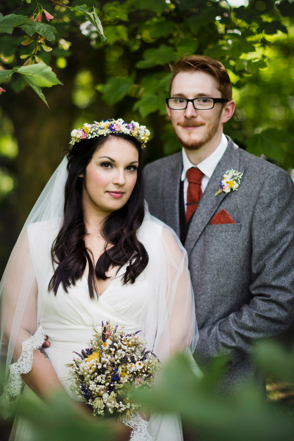 Etsy illustrator Kerris wore an ASOS wedding dress for her boho and handmade village hall wedding. We love the comic book confetti! Photography by Mark Tattersall.