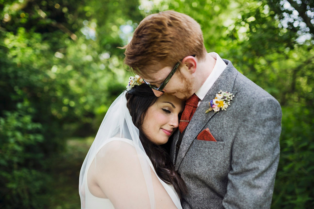 Etsy illustrator Kerris wore an ASOS wedding dress for her boho and handmade village hall wedding. We love the comic book confetti! Photography by Mark Tattersall.