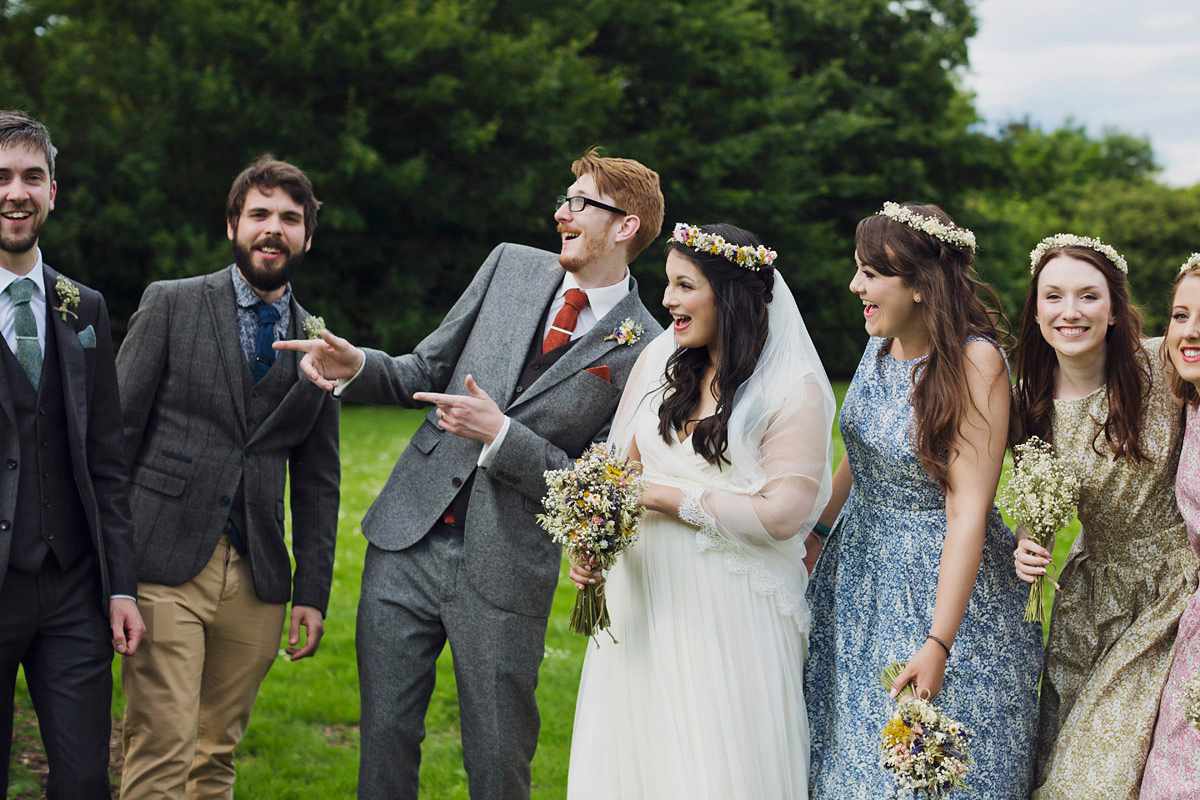 Etsy illustrator Kerris wore an ASOS wedding dress for her boho and handmade village hall wedding. We love the comic book confetti! Photography by Mark Tattersall.