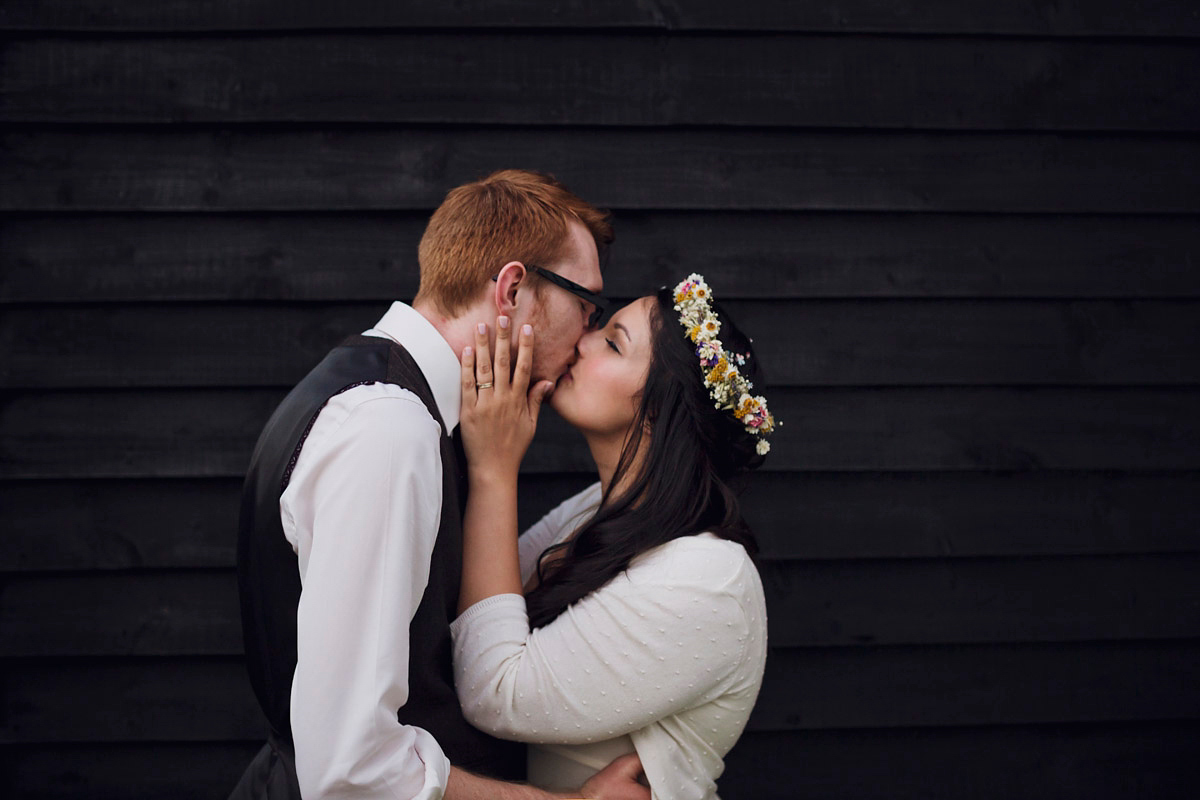 Etsy illustrator Kerris wore an ASOS wedding dress for her boho and handmade village hall wedding. We love the comic book confetti! Photography by Mark Tattersall.