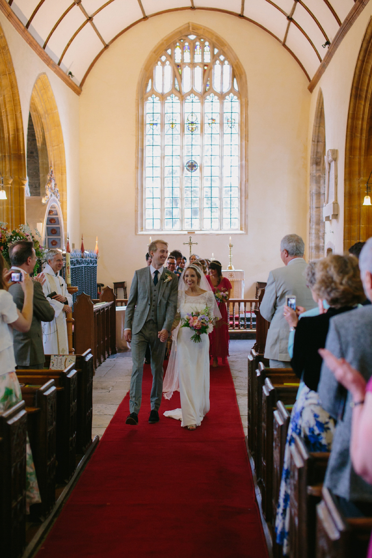 Elizabeth wore a Laure de Sagazan gown for her romantic, fun and colourful Somerset wedding. Photography by The Retreat.