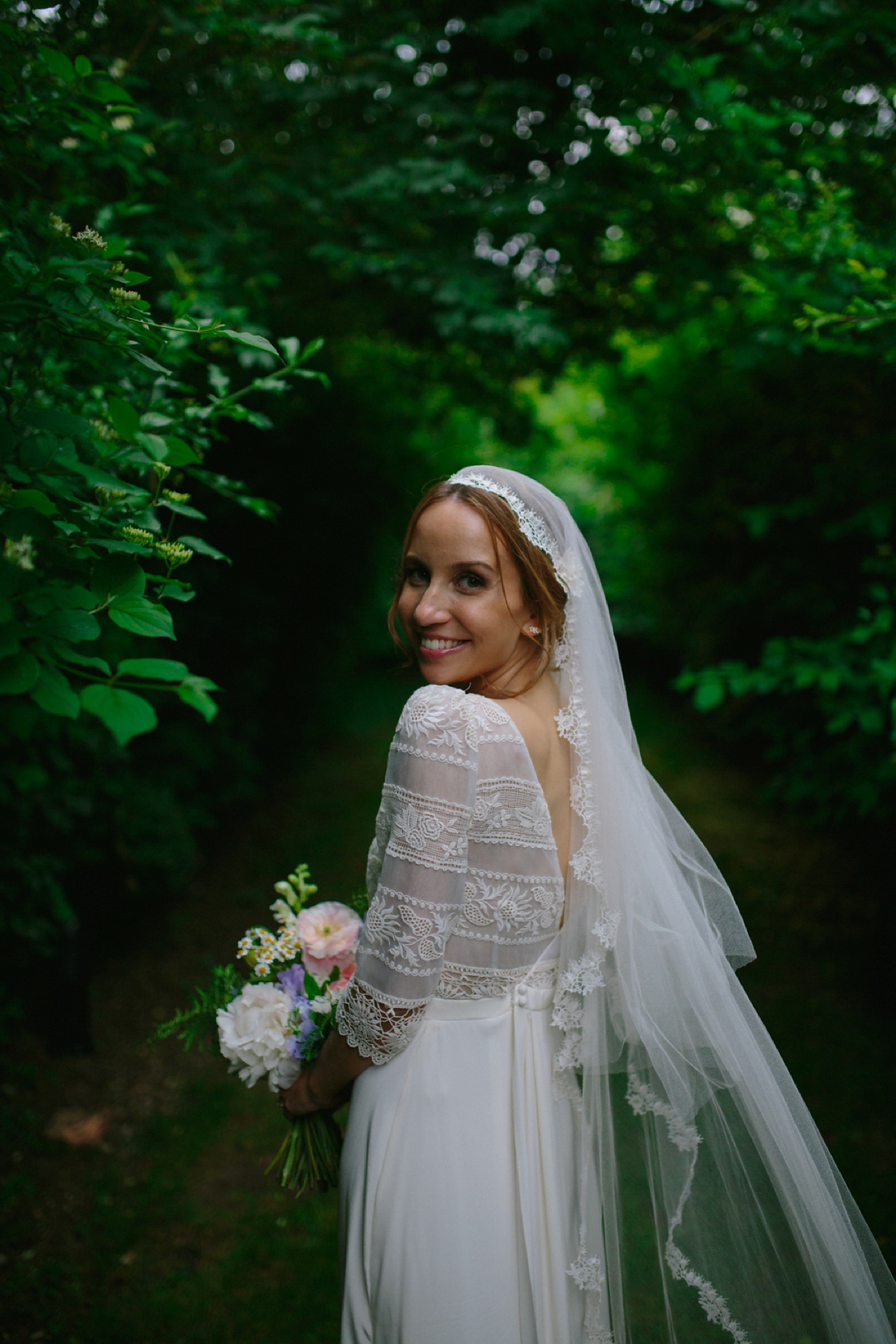 Elizabeth wore a Laure de Sagazan gown for her romantic, fun and colourful Somerset wedding. Photography by The Retreat.