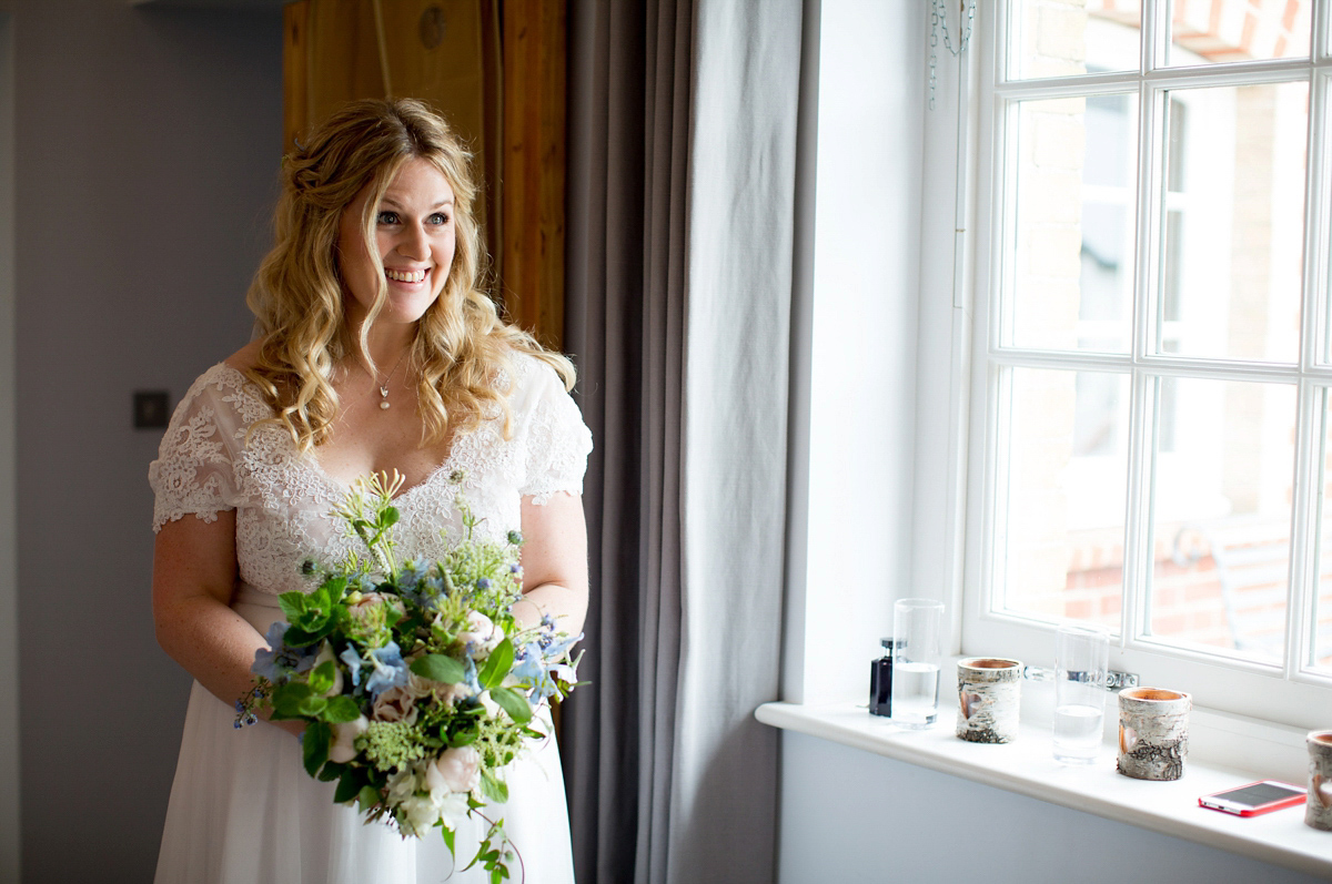 Victoria wore a Cymbeline Paris gown from Mirror Mirror Bridal in Islington for her relaxed and romantic country wedding. The reception was styled like a Green Tavern with long banquet tables. Photography by Helen Cawte.