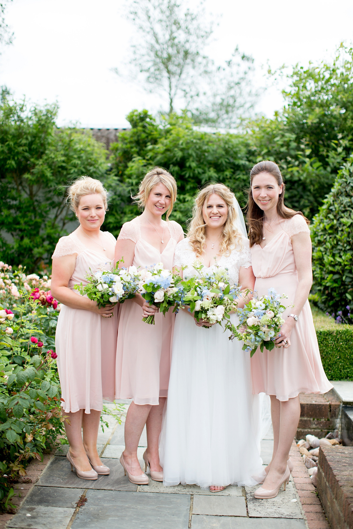 Victoria wore a Cymbeline Paris gown from Mirror Mirror Bridal in Islington for her relaxed and romantic country wedding. The reception was styled like a Green Tavern with long banquet tables. Photography by Helen Cawte.