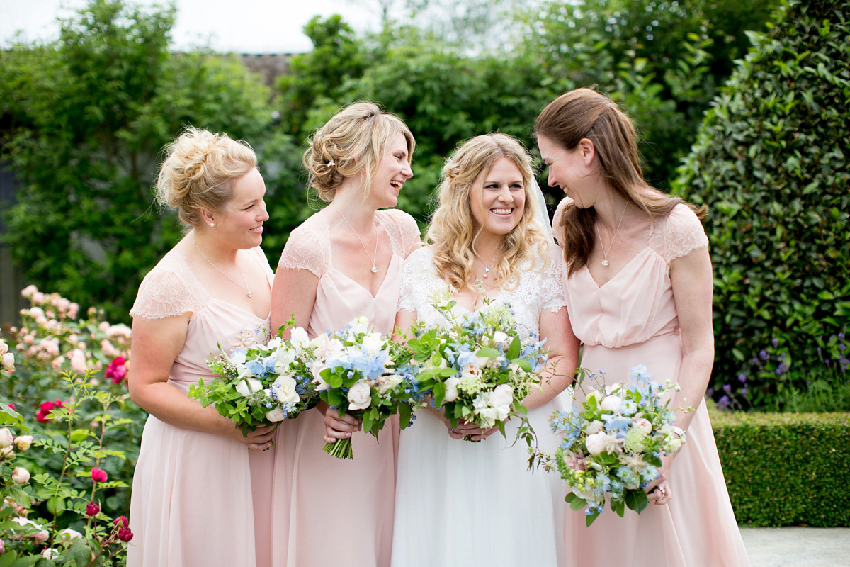 Victoria wore a Cymbeline Paris gown from Mirror Mirror Bridal in Islington for her relaxed and romantic country wedding. The reception was styled like a Green Tavern with long banquet tables. Photography by Helen Cawte.