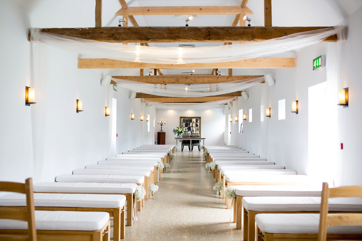 Victoria wore a Cymbeline Paris gown from Mirror Mirror Bridal in Islington for her relaxed and romantic country wedding. The reception was styled like a Green Tavern with long banquet tables. Photography by Helen Cawte.