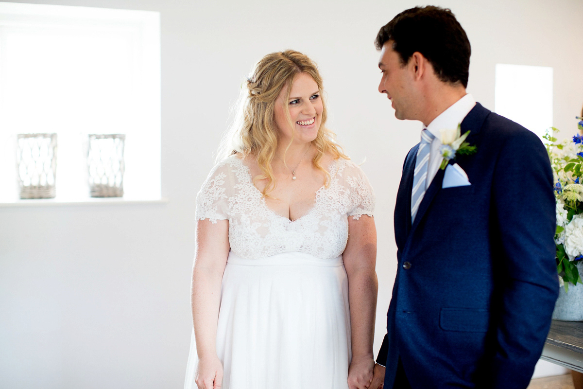 Victoria wore a Cymbeline Paris gown from Mirror Mirror Bridal in Islington for her relaxed and romantic country wedding. The reception was styled like a Green Tavern with long banquet tables. Photography by Helen Cawte.