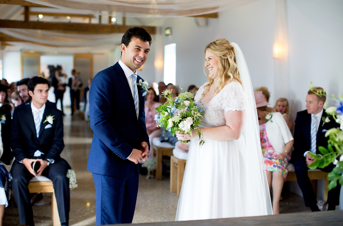 Victoria wore a Cymbeline Paris gown from Mirror Mirror Bridal in Islington for her relaxed and romantic country wedding. The reception was styled like a Green Tavern with long banquet tables. Photography by Helen Cawte.