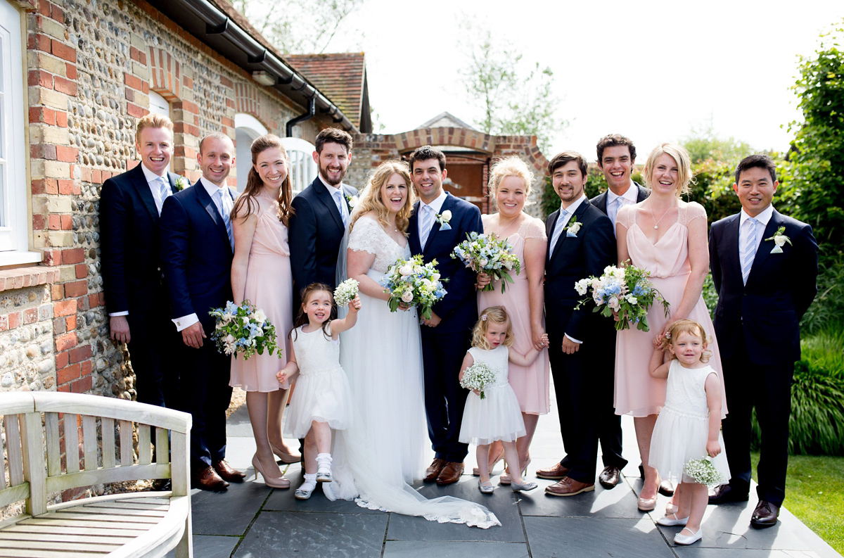 Victoria wore a Cymbeline Paris gown from Mirror Mirror Bridal in Islington for her relaxed and romantic country wedding. The reception was styled like a Green Tavern with long banquet tables. Photography by Helen Cawte.