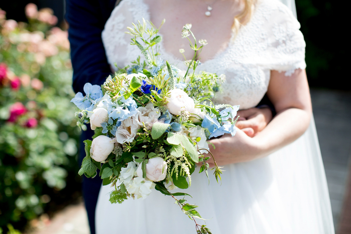 Victoria wore a Cymbeline Paris gown from Mirror Mirror Bridal in Islington for her relaxed and romantic country wedding. The reception was styled like a Green Tavern with long banquet tables. Photography by Helen Cawte.