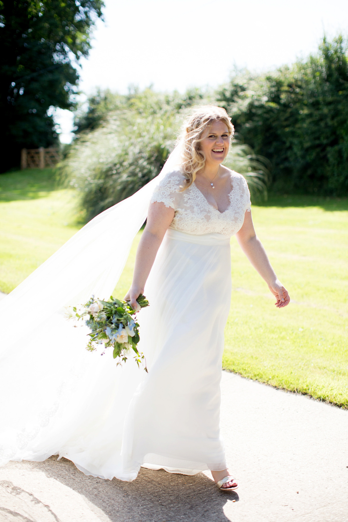 Victoria wore a Cymbeline Paris gown from Mirror Mirror Bridal in Islington for her relaxed and romantic country wedding. The reception was styled like a Green Tavern with long banquet tables. Photography by Helen Cawte.