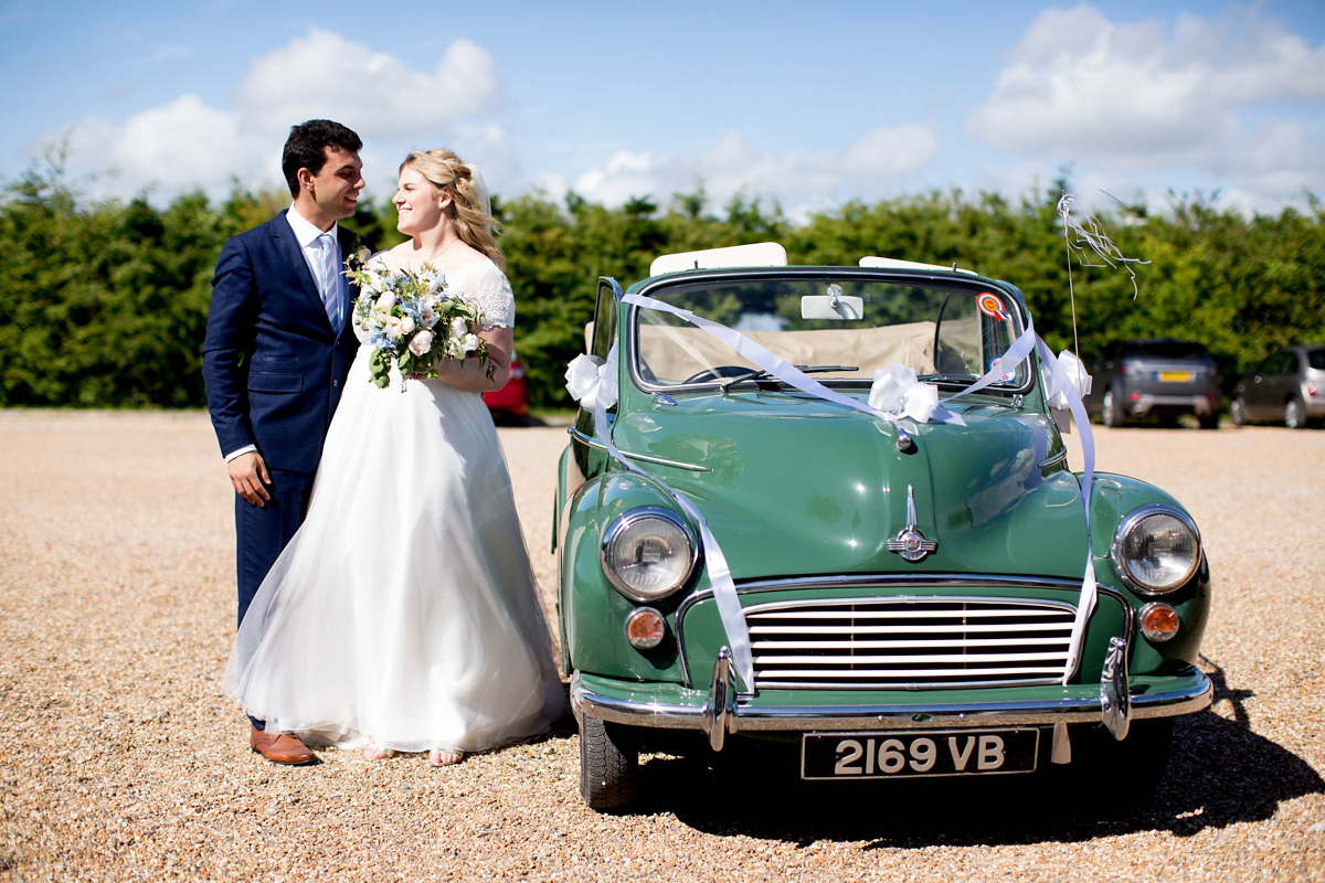 Victoria wore a Cymbeline Paris gown from Mirror Mirror Bridal in Islington for her relaxed and romantic country wedding. The reception was styled like a Green Tavern with long banquet tables. Photography by Helen Cawte.