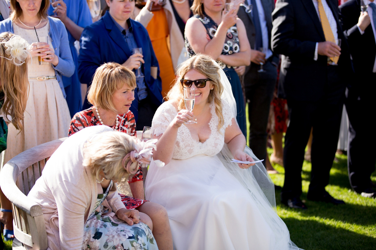 Victoria wore a Cymbeline Paris gown from Mirror Mirror Bridal in Islington for her relaxed and romantic country wedding. The reception was styled like a Green Tavern with long banquet tables. Photography by Helen Cawte.