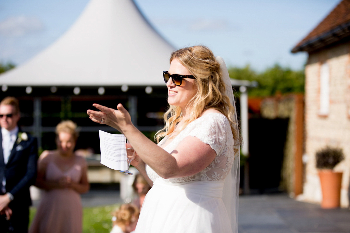 Victoria wore a Cymbeline Paris gown from Mirror Mirror Bridal in Islington for her relaxed and romantic country wedding. The reception was styled like a Green Tavern with long banquet tables. Photography by Helen Cawte.