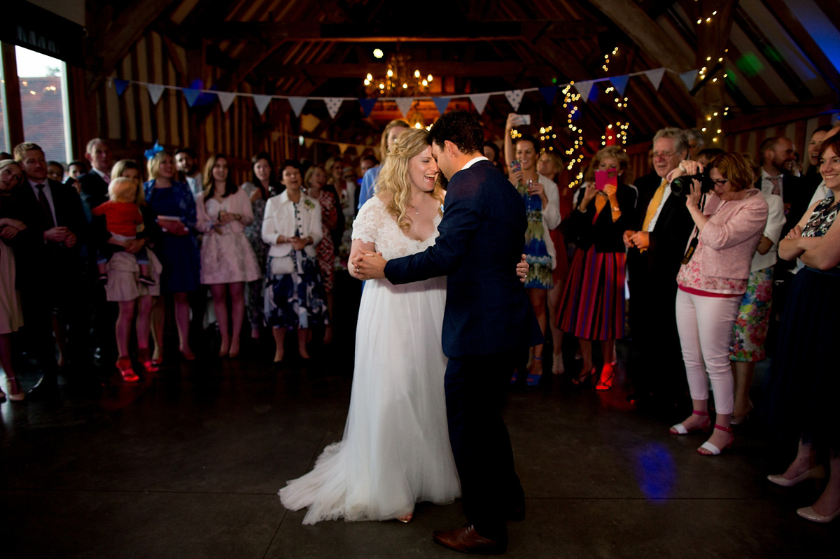 Victoria wore a Cymbeline Paris gown from Mirror Mirror Bridal in Islington for her relaxed and romantic country wedding. The reception was styled like a Green Tavern with long banquet tables. Photography by Helen Cawte.