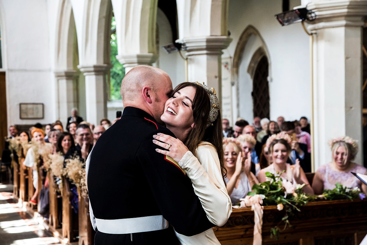 Layla wore a 1930's vintage dress for her summer country marquee wedding. Photography by Hannah Betts.