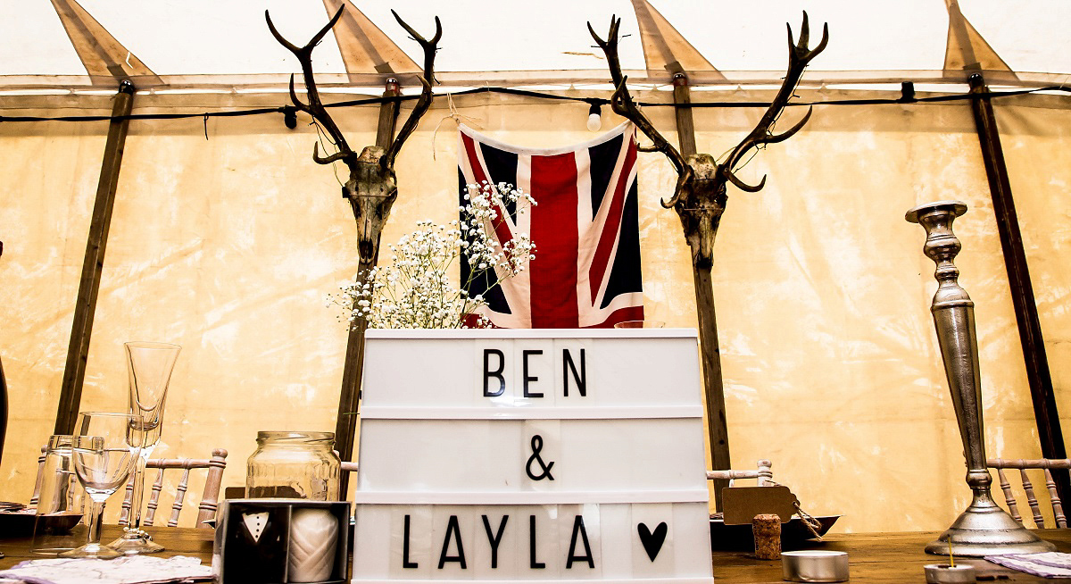 Layla wore a 1930's vintage dress for her summer country marquee wedding. Photography by Hannah Betts.