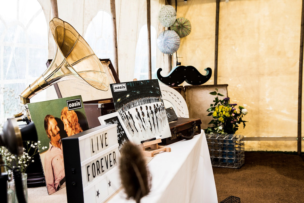 Layla wore a 1930's vintage dress for her summer country marquee wedding. Photography by Hannah Betts.