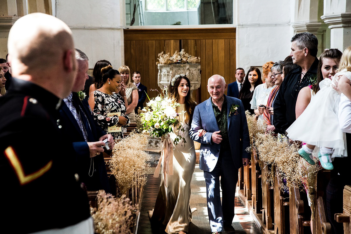 Layla wore a 1930's vintage dress for her summer country marquee wedding. Photography by Hannah Betts.