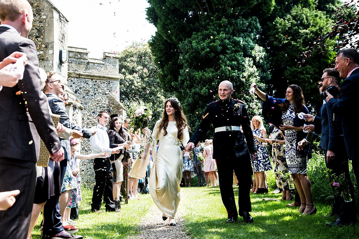 Layla wore a 1930's vintage dress for her summer country marquee wedding. Photography by Hannah Betts.