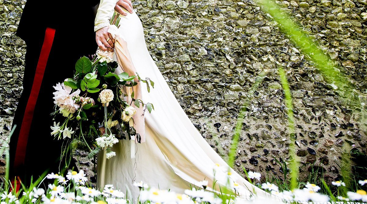 Layla wore a 1930's vintage dress for her summer country marquee wedding. Photography by Hannah Betts.