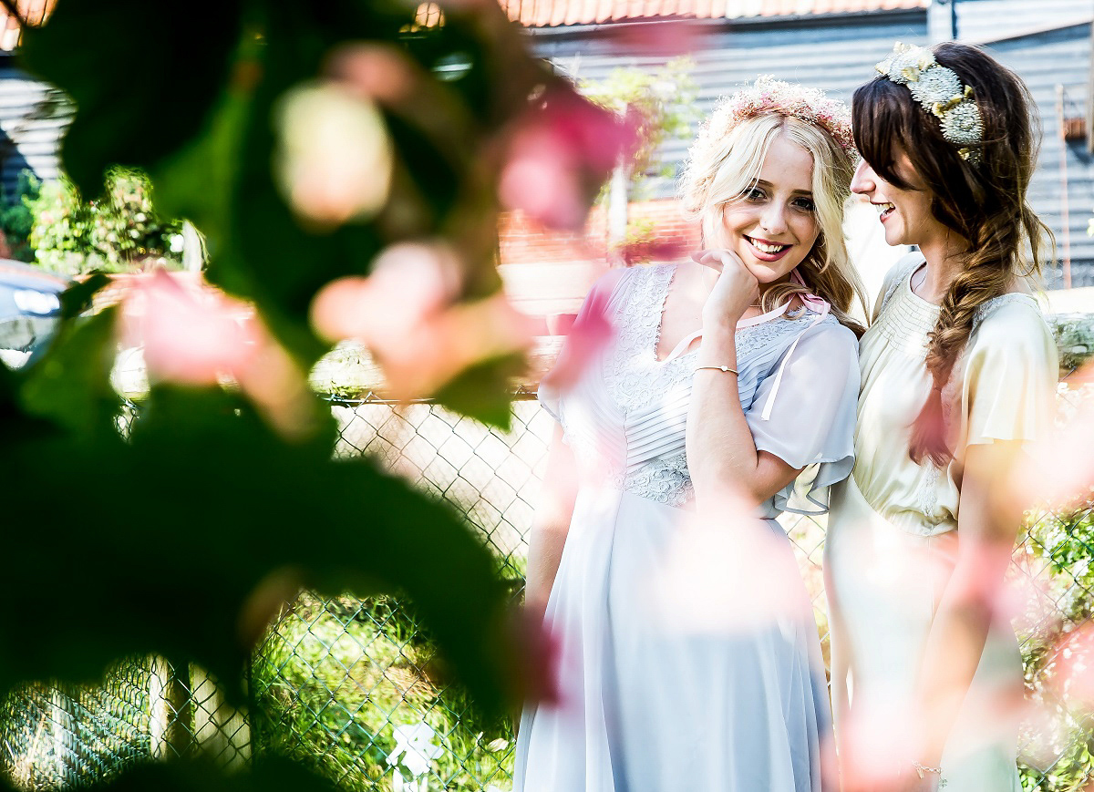 Layla wore a 1930's vintage dress for her summer country marquee wedding. Photography by Hannah Betts.