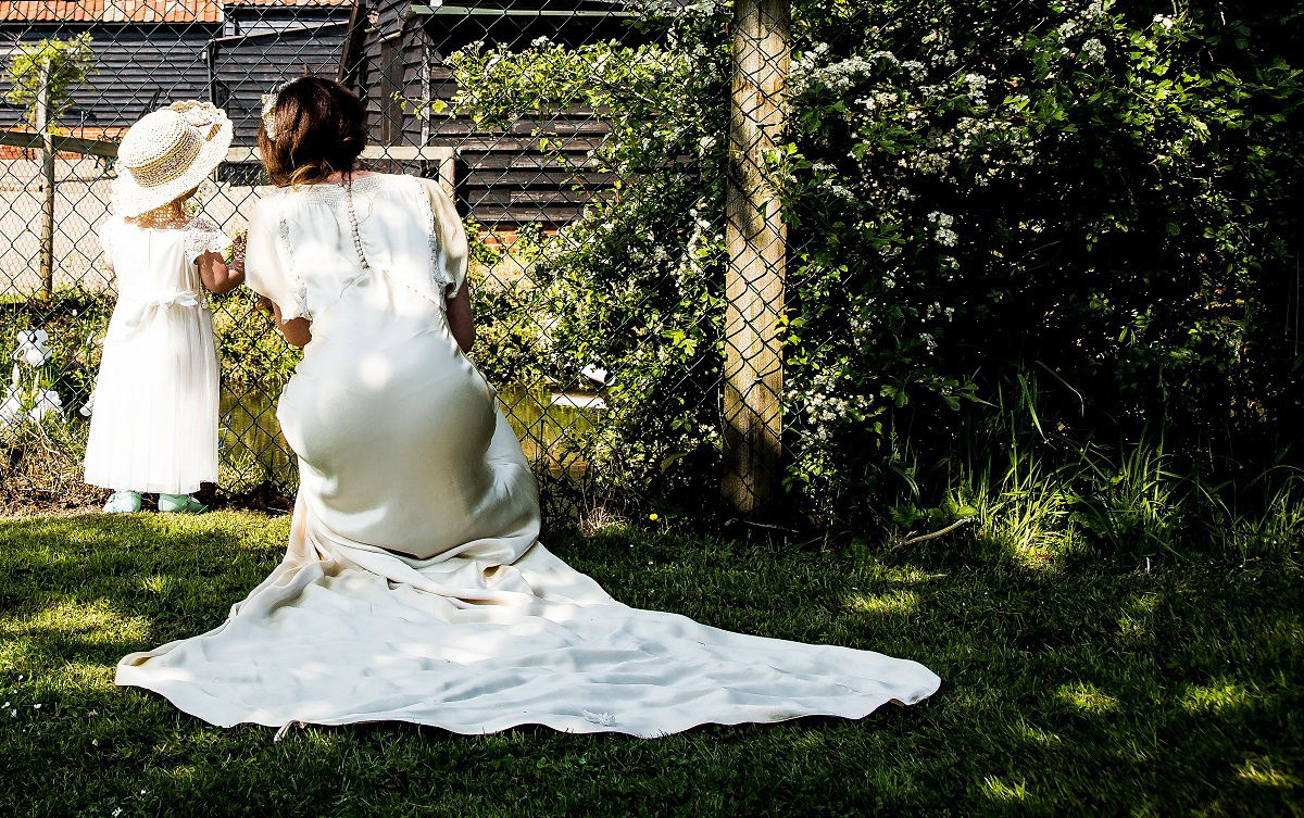 Layla wore a 1930's vintage dress for her summer country marquee wedding. Photography by Hannah Betts.