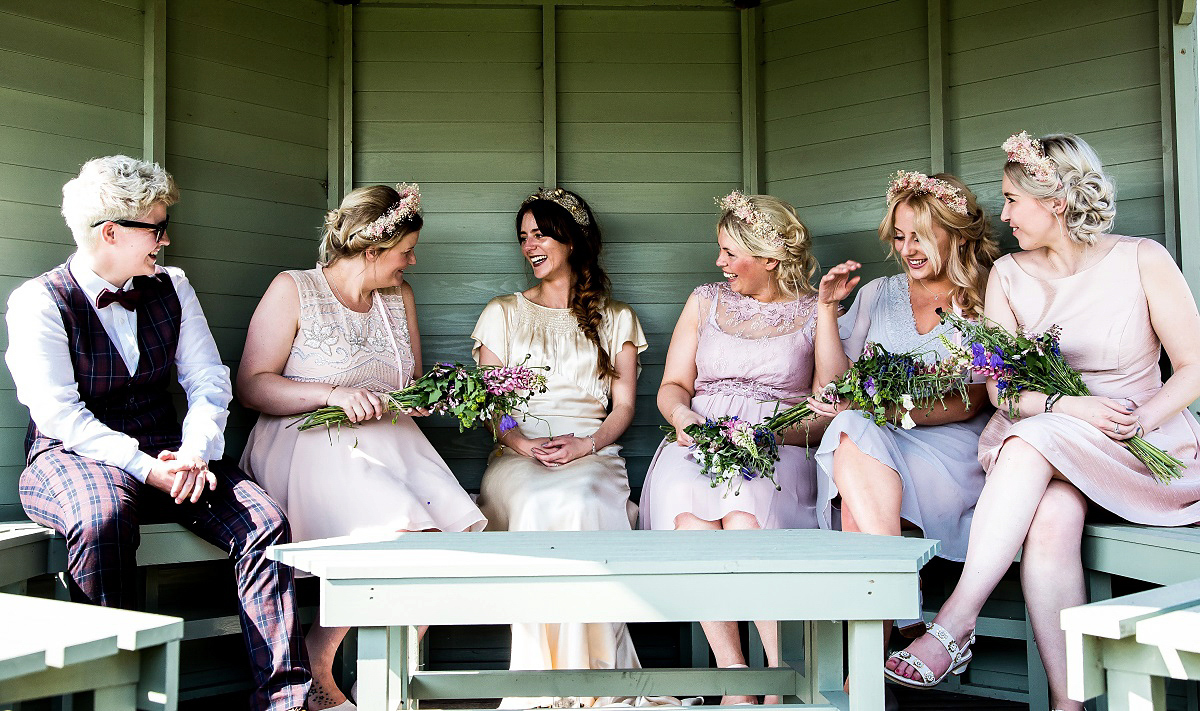 Layla wore a 1930's vintage dress for her summer country marquee wedding. Photography by Hannah Betts.