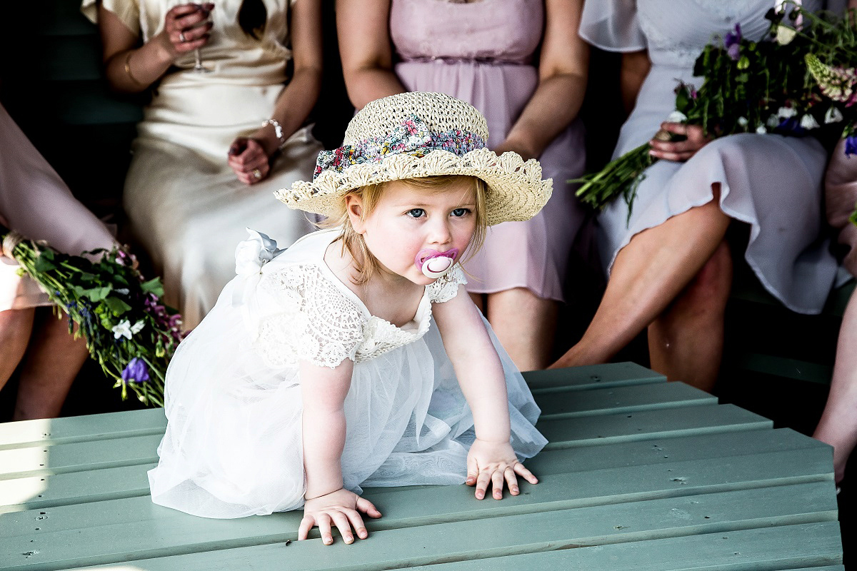 Layla wore a 1930's vintage dress for her summer country marquee wedding. Photography by Hannah Betts.