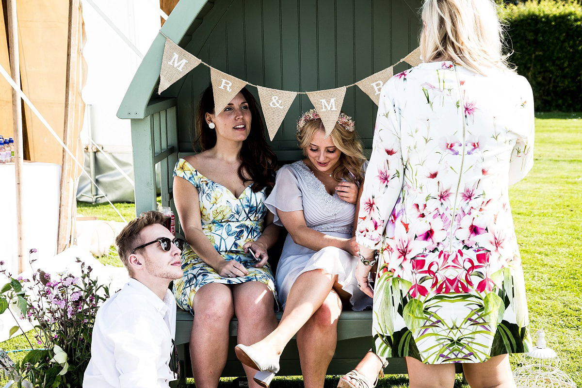 Layla wore a 1930's vintage dress for her summer country marquee wedding. Photography by Hannah Betts.