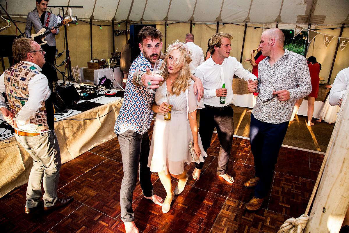 Layla wore a 1930's vintage dress for her summer country marquee wedding. Photography by Hannah Betts.