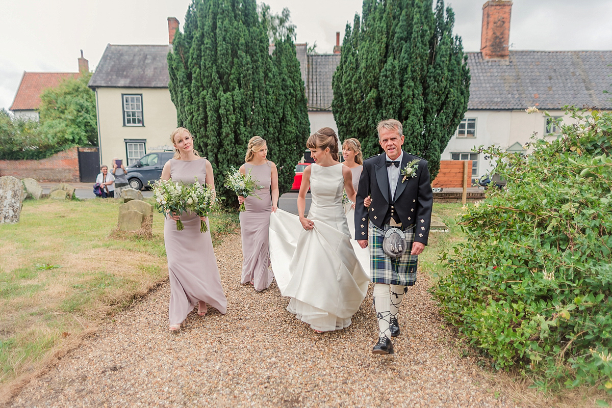 Lyndsey wore a Pronovias gown for her cycling inspired Suffolk Village wedding. Photography by Kerrie Mitchell.