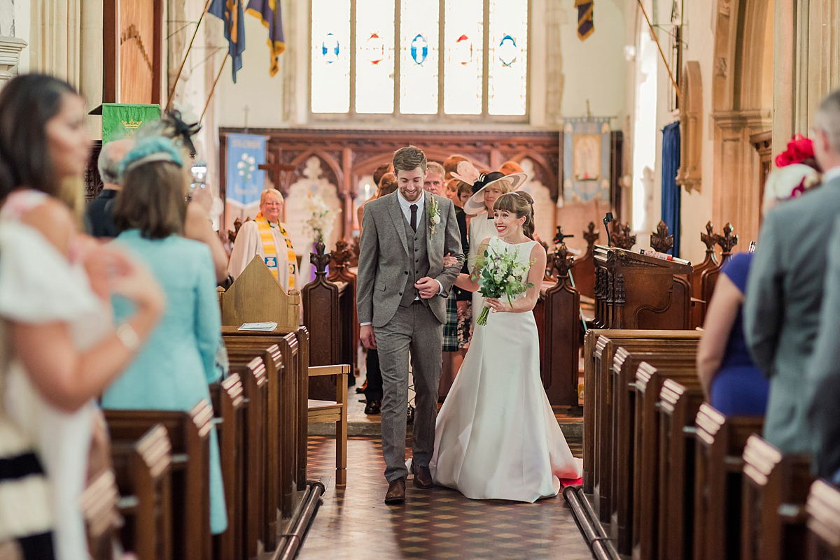 Lyndsey wore a Pronovias gown for her cycling inspired Suffolk Village wedding. Photography by Kerrie Mitchell.