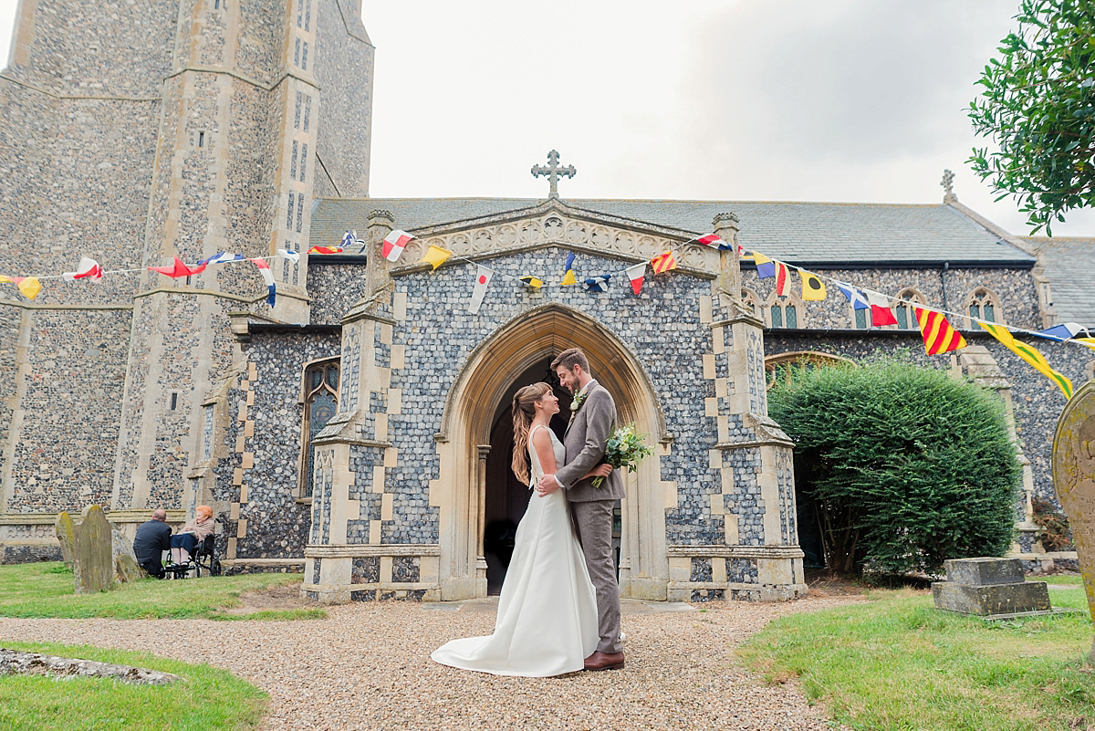 Lyndsey wore a Pronovias gown for her cycling inspired Suffolk Village wedding. Photography by Kerrie Mitchell.