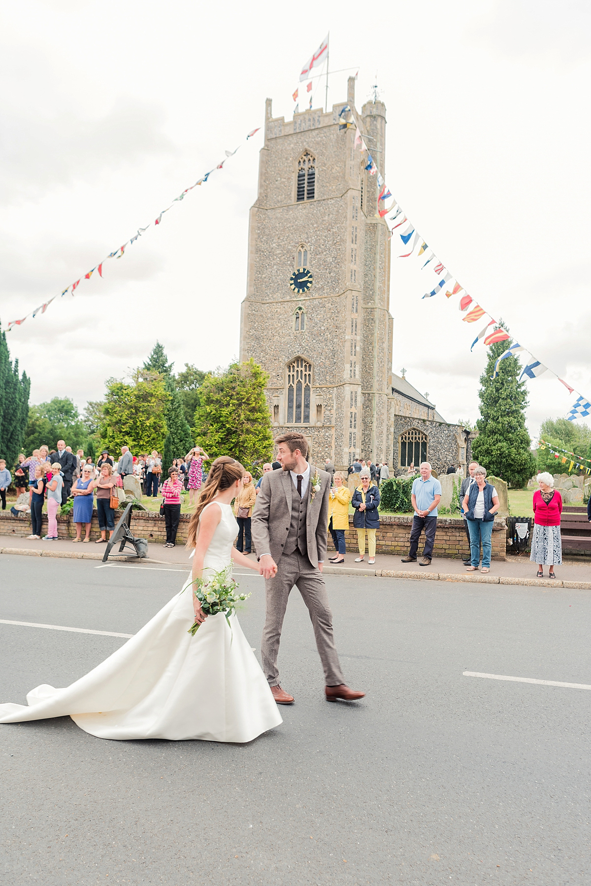 Lyndsey wore a Pronovias gown for her cycling inspired Suffolk Village wedding. Photography by Kerrie Mitchell.