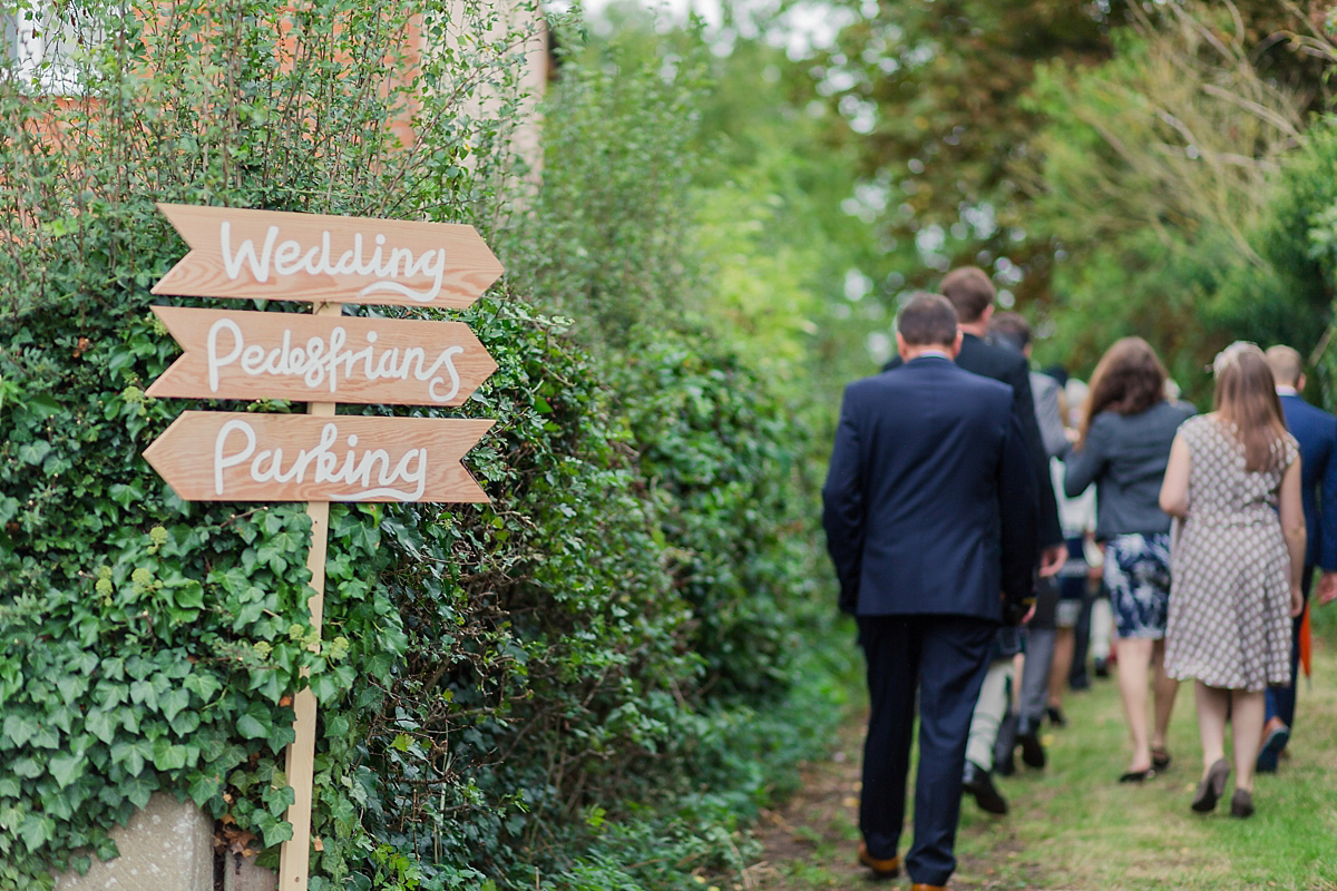 Lyndsey wore a Pronovias gown for her cycling inspired Suffolk Village wedding. Photography by Kerrie Mitchell.