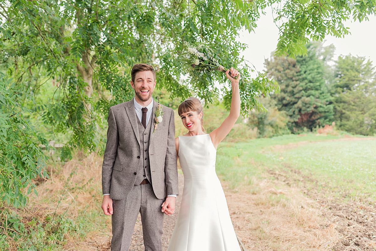 Lyndsey wore a Pronovias gown for her cycling inspired Suffolk Village wedding. Photography by Kerrie Mitchell.