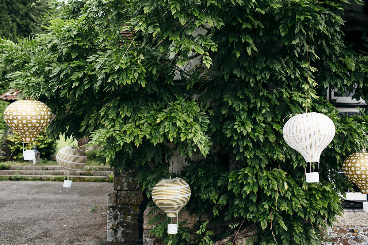 Emily wore a Needle & Thread dress for her colourful, balloon and glitter filled wedding at Coombe Trenchard. Images by Freckle Photography.