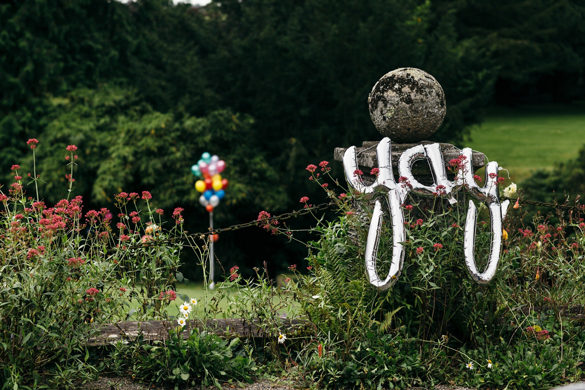 Emily wore a Needle & Thread dress for her colourful, balloon and glitter filled wedding at Coombe Trenchard. Images by Freckle Photography.