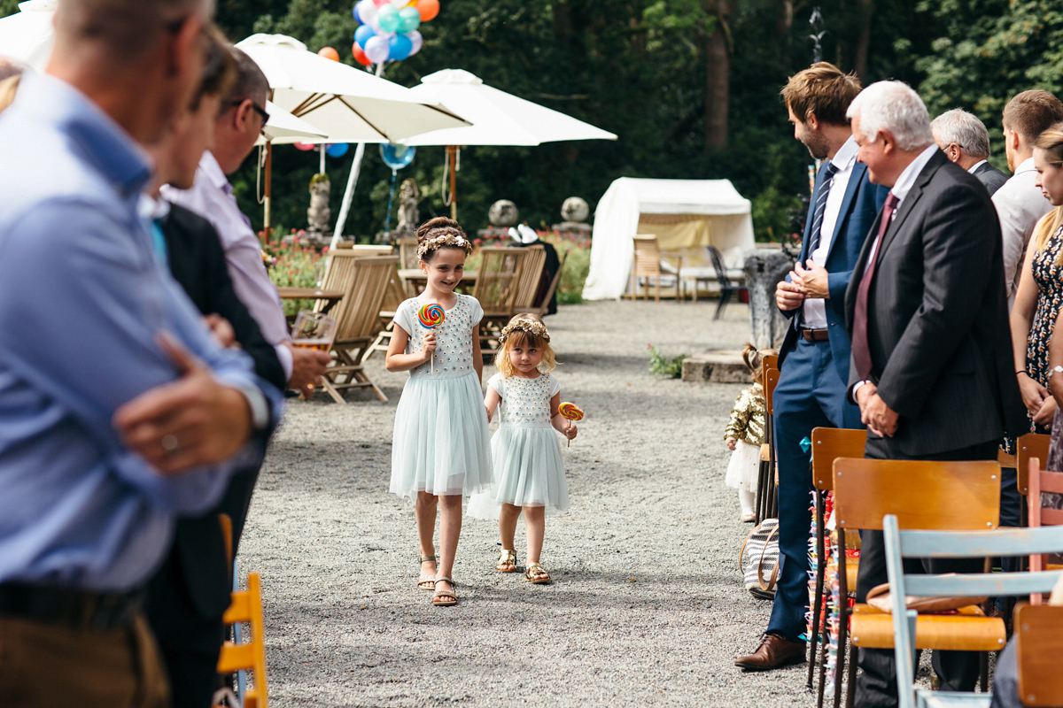 Emily wore a Needle & Thread dress for her colourful, balloon and glitter filled wedding at Coombe Trenchard. Images by Freckle Photography.