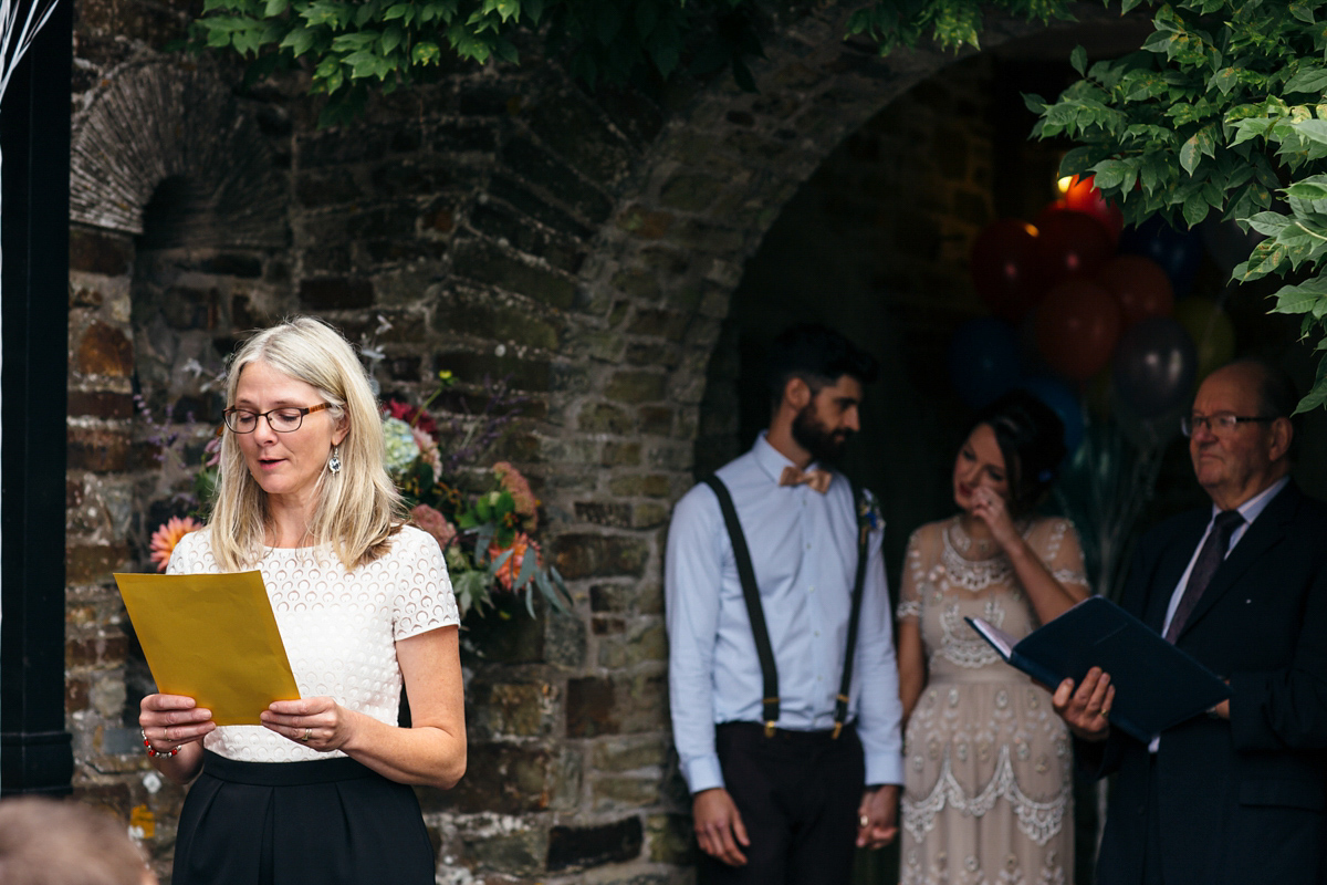 Emily wore a Needle & Thread dress for her colourful, balloon and glitter filled wedding at Coombe Trenchard. Images by Freckle Photography.