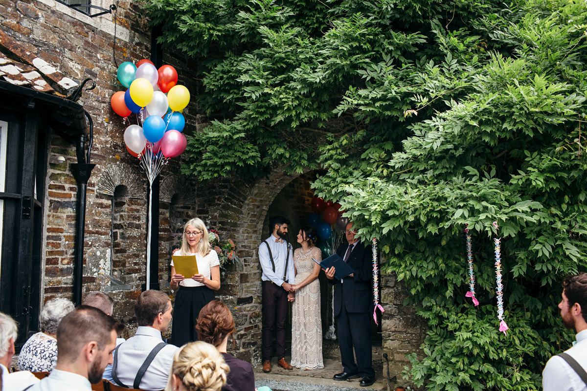 Emily wore a Needle & Thread dress for her colourful, balloon and glitter filled wedding at Coombe Trenchard. Images by Freckle Photography.