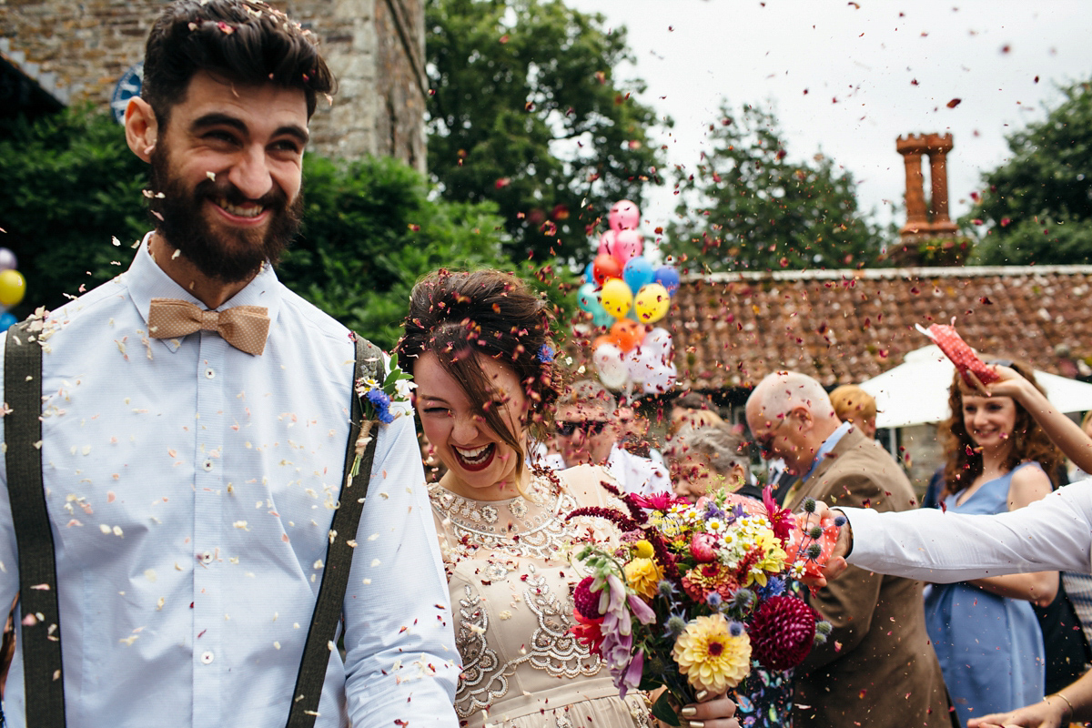 Emily wore a Needle & Thread dress for her colourful, balloon and glitter filled wedding at Coombe Trenchard. Images by Freckle Photography.