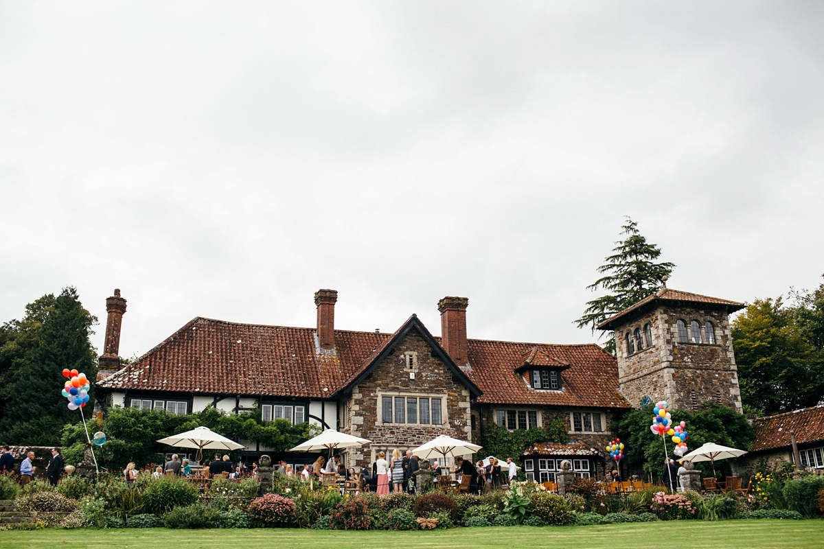 Emily wore a Needle & Thread dress for her colourful, balloon and glitter filled wedding at Coombe Trenchard. Images by Freckle Photography.