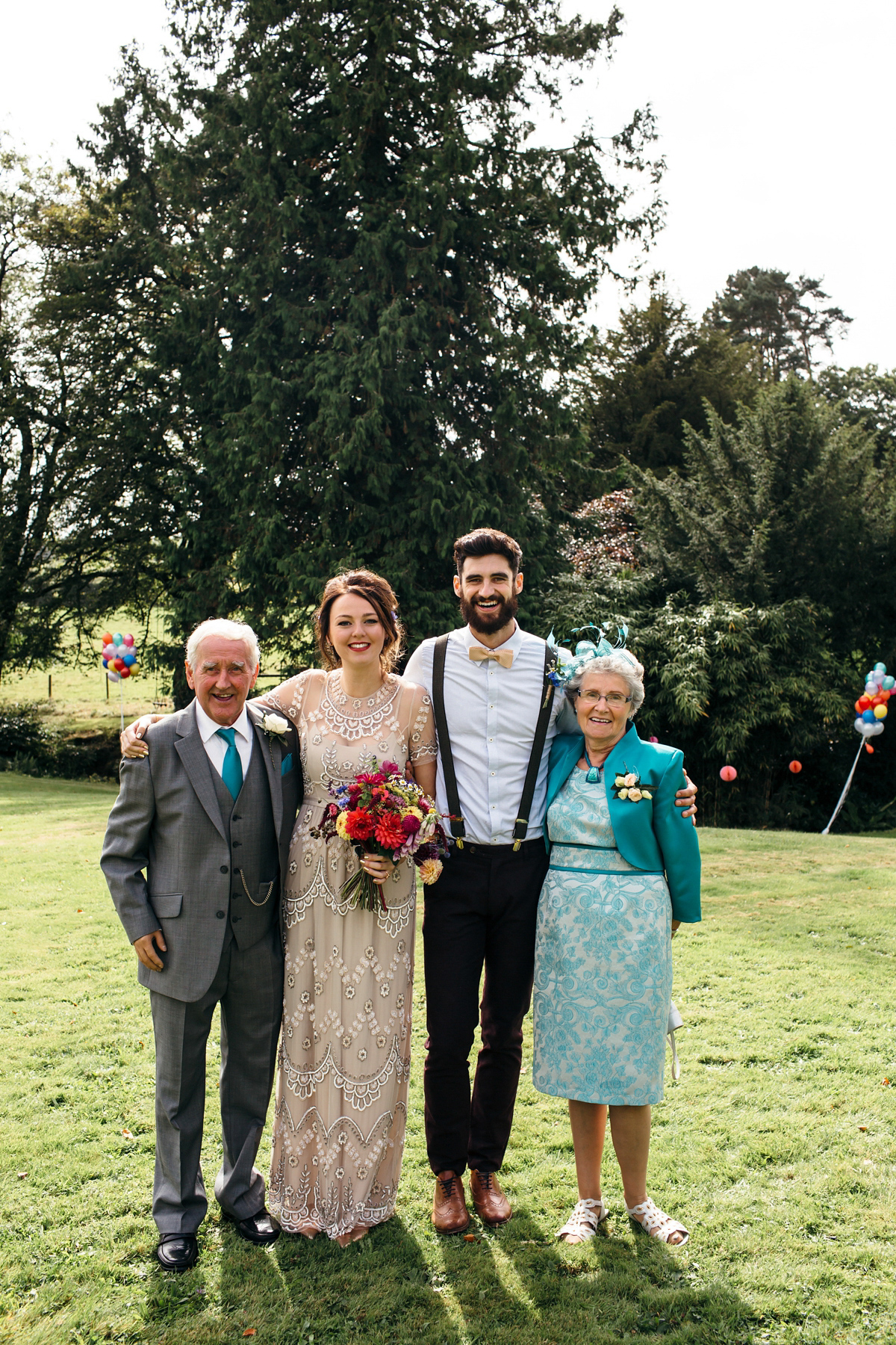 Emily wore a Needle & Thread dress for her colourful, balloon and glitter filled wedding at Coombe Trenchard. Images by Freckle Photography.