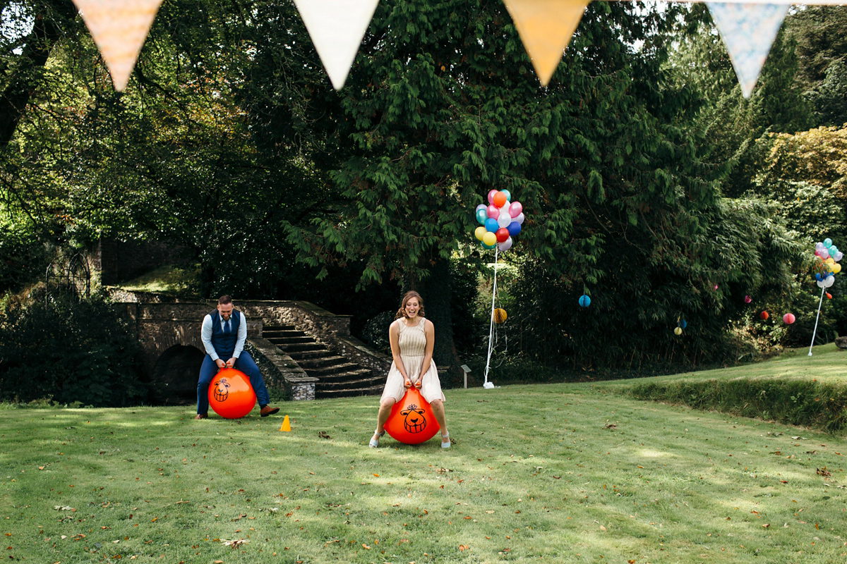 Emily wore a Needle & Thread dress for her colourful, balloon and glitter filled wedding at Coombe Trenchard. Images by Freckle Photography.