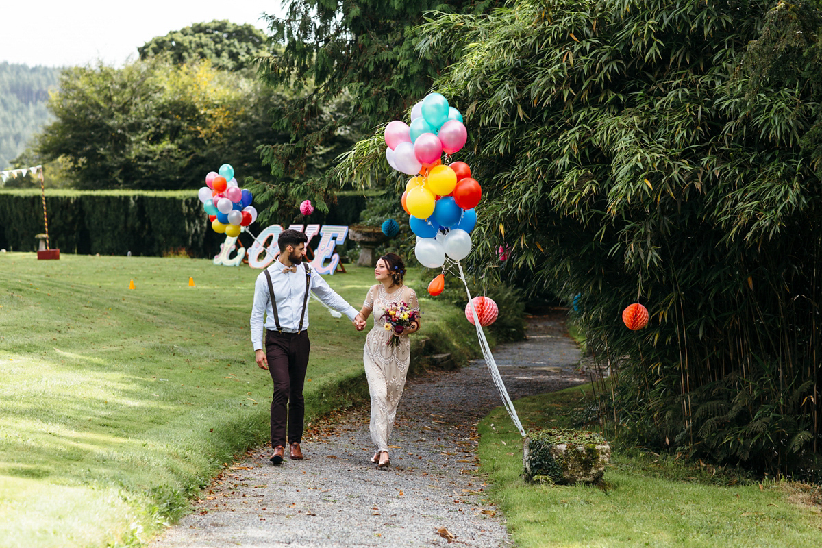 Emily wore a Needle & Thread dress for her colourful, balloon and glitter filled wedding at Coombe Trenchard. Images by Freckle Photography.