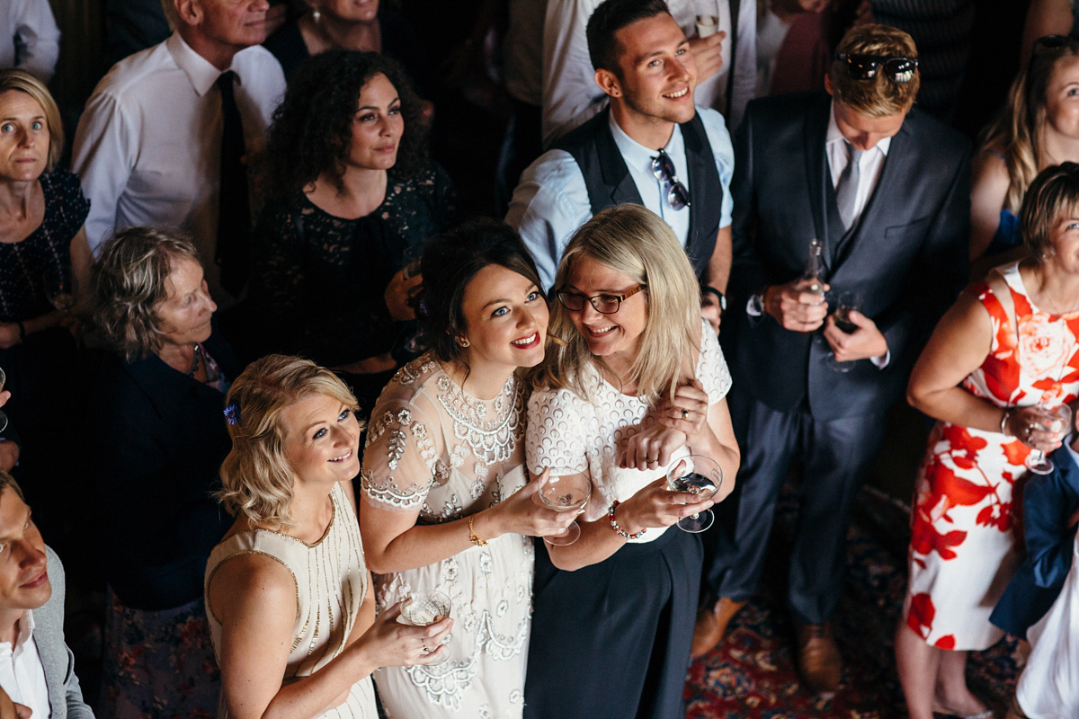 Emily wore a Needle & Thread dress for her colourful, balloon and glitter filled wedding at Coombe Trenchard. Images by Freckle Photography.