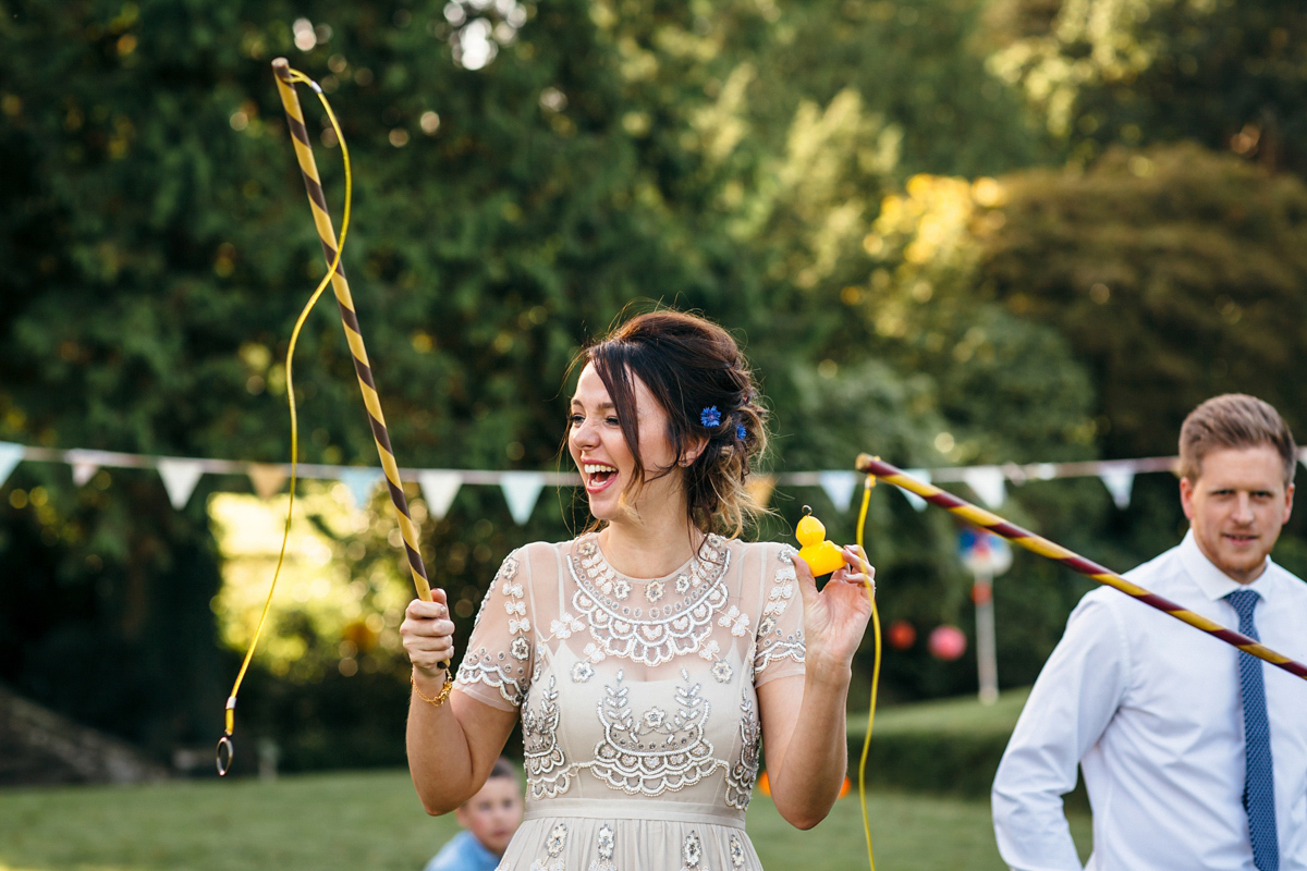 Emily wore a Needle & Thread dress for her colourful, balloon and glitter filled wedding at Coombe Trenchard. Images by Freckle Photography.